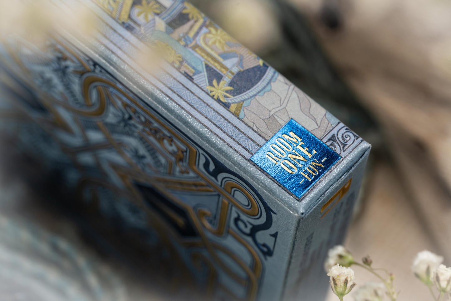 Close-up of a Babylon playing cards tuck box with intricate design.