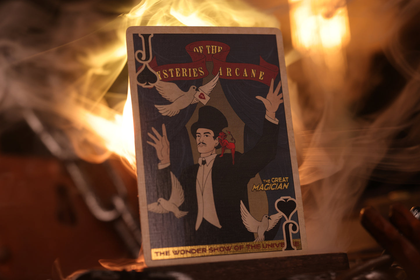 Court card with 'Mysteries Arcane' design featuring a magician and birds against a fiery background.