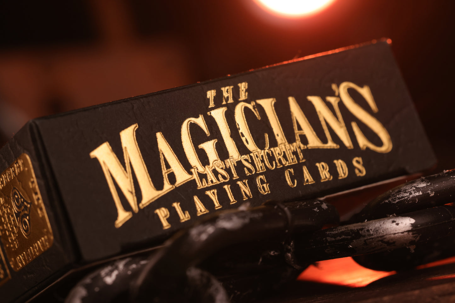 Black box of 'The Magician's Last Secret Playing Cards' with gold text