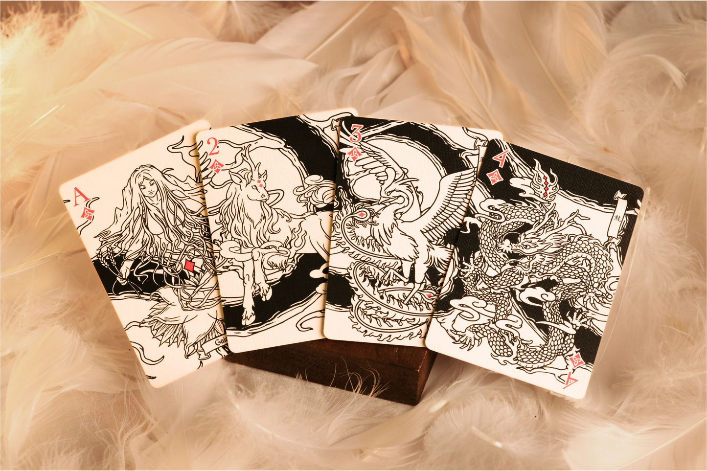 MYTHIC edition Fury of Light number cards with intricate designs on a soft surface.