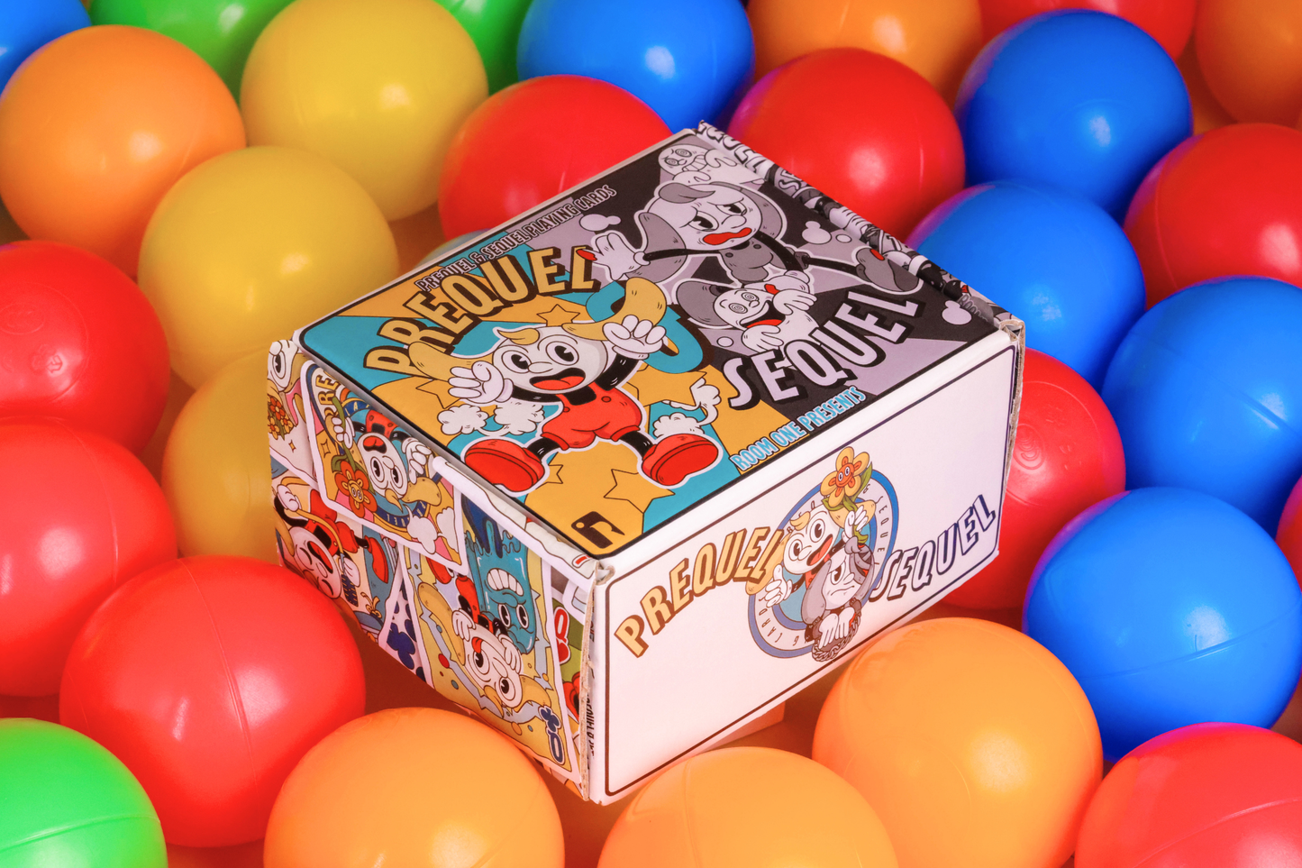 Prequel & Sequel Half-Brick box surrounded by colorful plastic balls