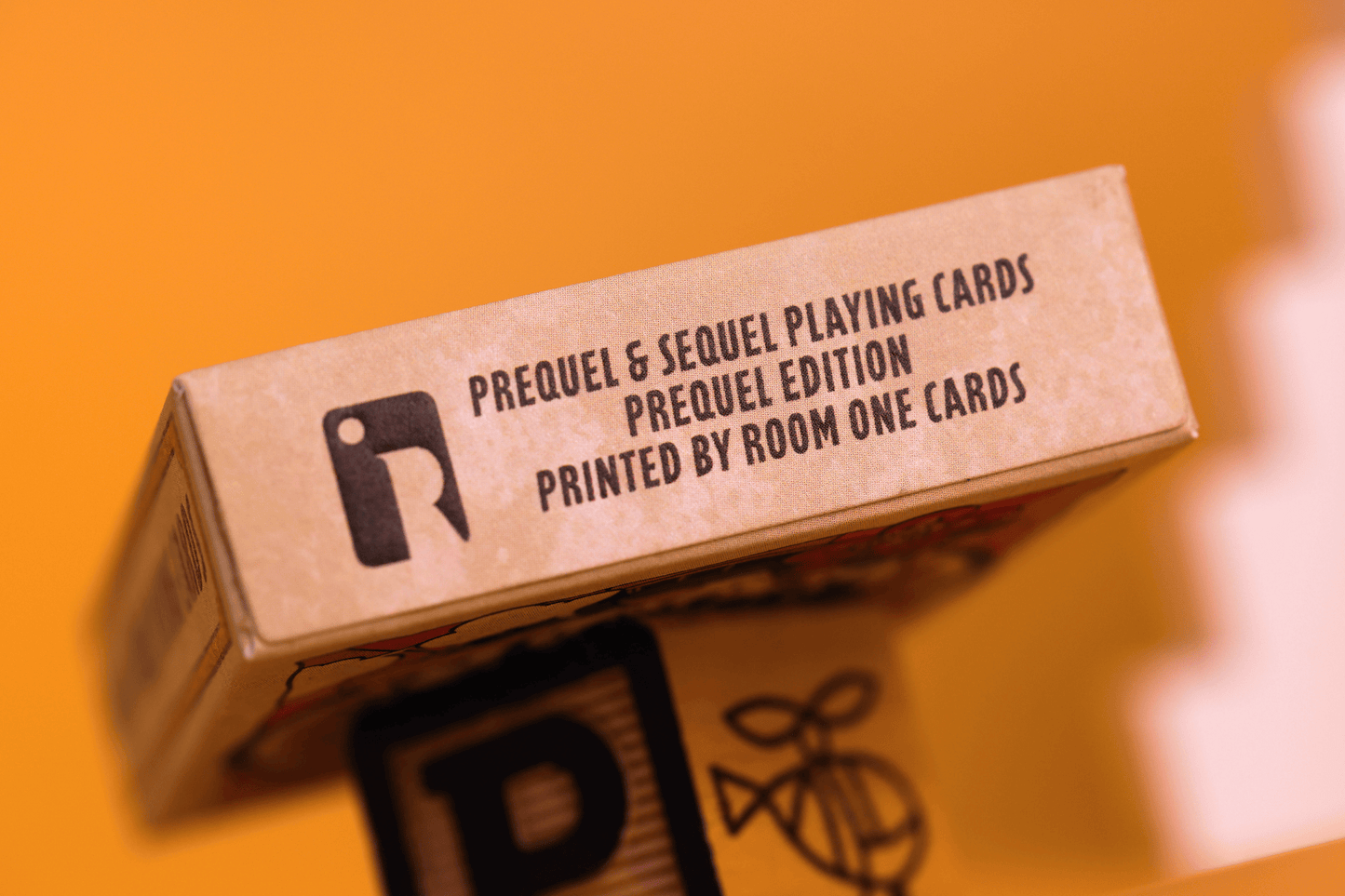 Prequel Edition Tuck Box with text and logo on a yellow background
