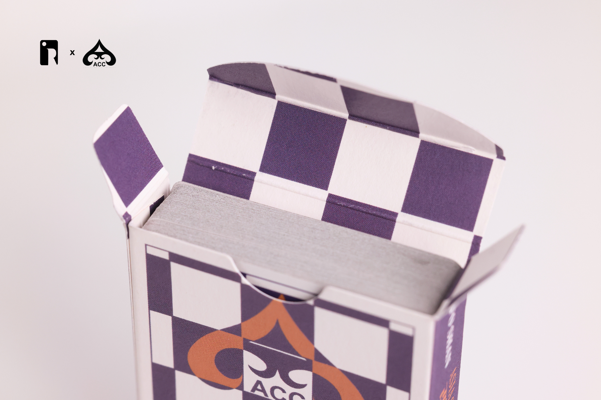 Checkered tuck box interior with ACC logo on a white background