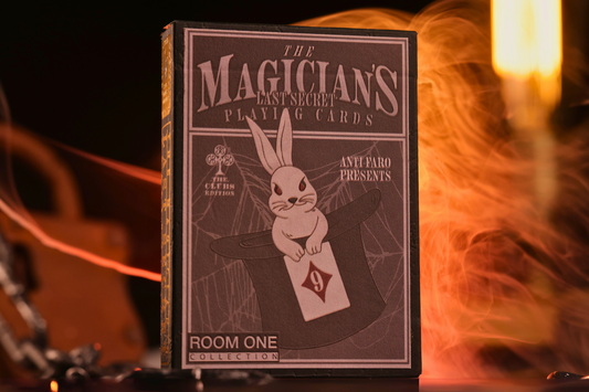 Clubs ediotion tuck box labeled 'The Magician's Last Secret' with a rabbit in a hat on a dark background.