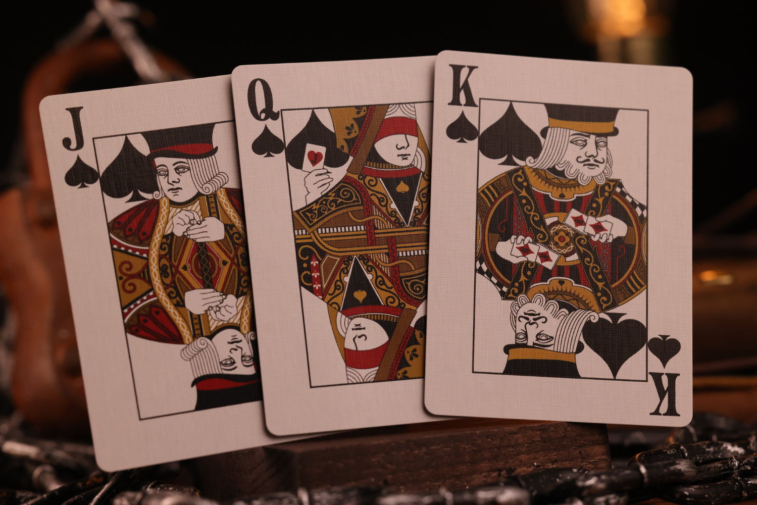 Diamonds Edition Court cards (Jack, Queen, King of Spades) on a dark background
