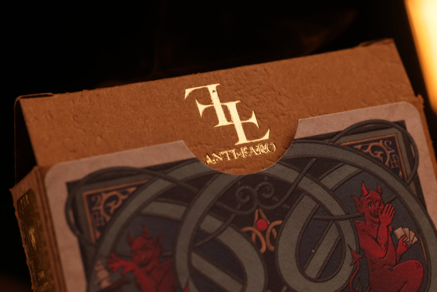 Hearts Edition tuck box with intricate designs and a gold hot foil 'anti-faro' logo on a dark background