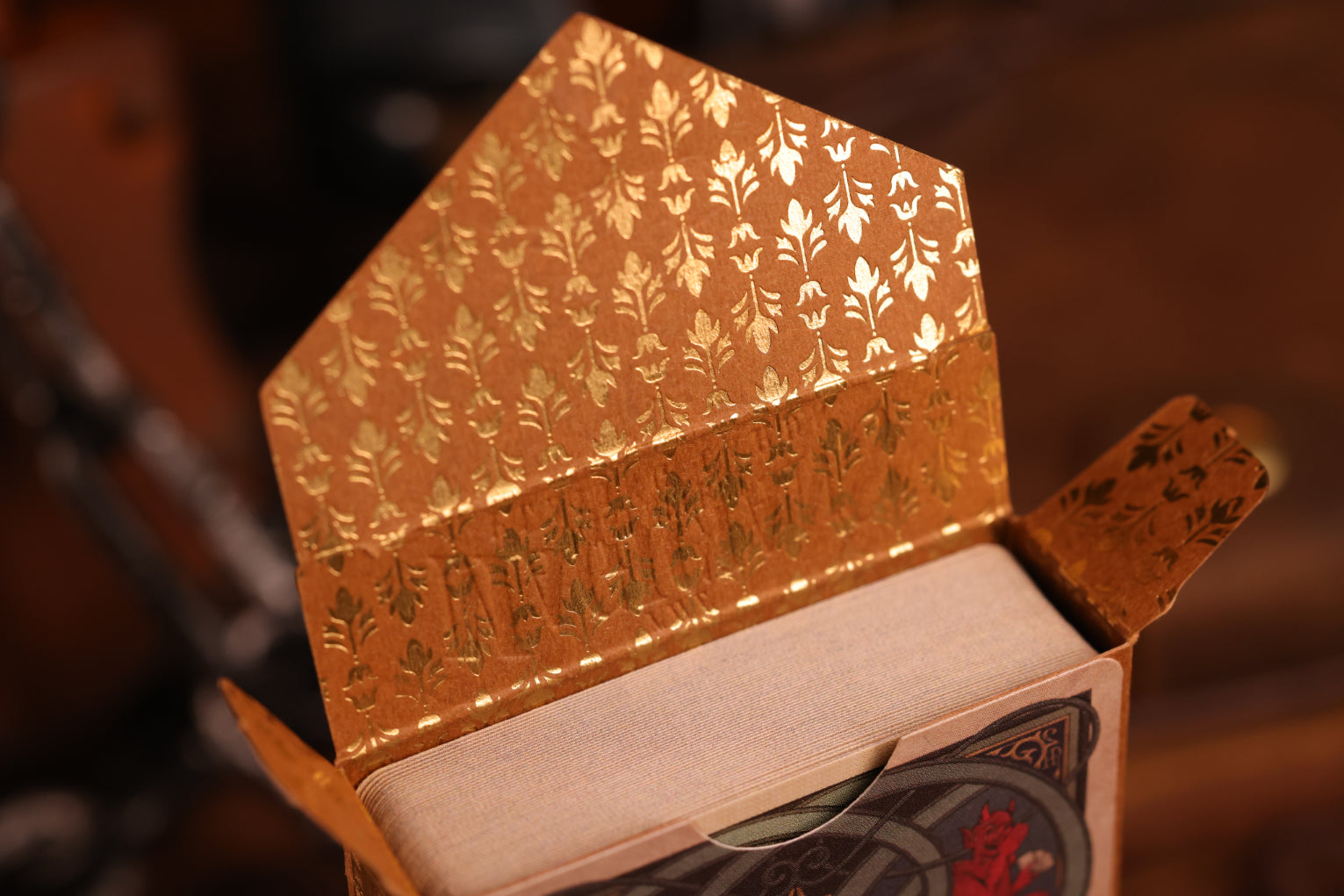 Hearts Edition tuck box interior featuring an intricate gold hot foil design