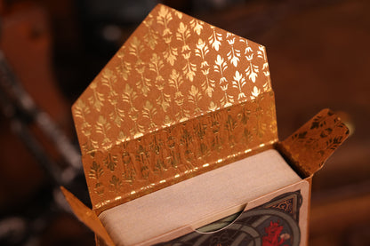 Hearts Edition tuck box interior featuring an intricate gold hot foil design