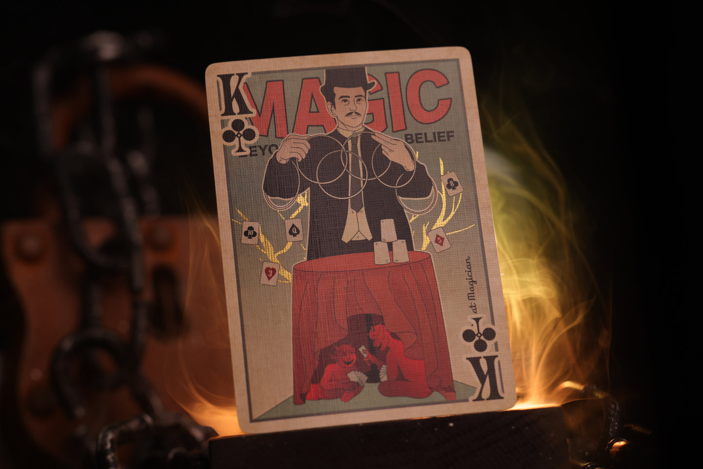 Court card with a magician design and branding, surrounded by flames on a dark background.