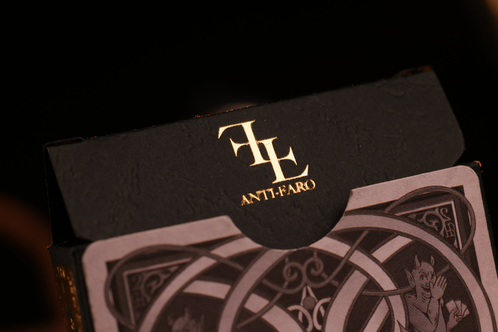 Clubs Edition tuck box with a gold hot foil 'AntiFaro' branding on a dark background
