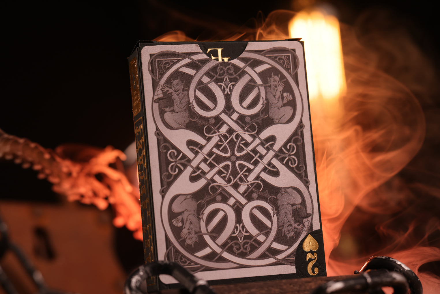 Clubs edition tuck box rear with intricate design on a firery background