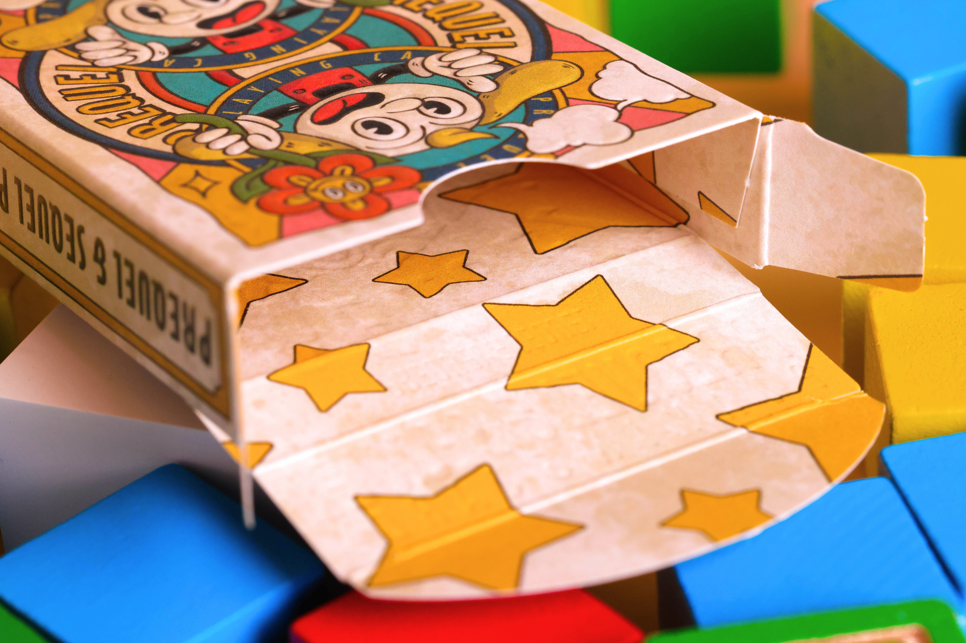 Close-up on the Prequel Playing Cards Tuck Box Interior, featuring classic designs of 5-point stars