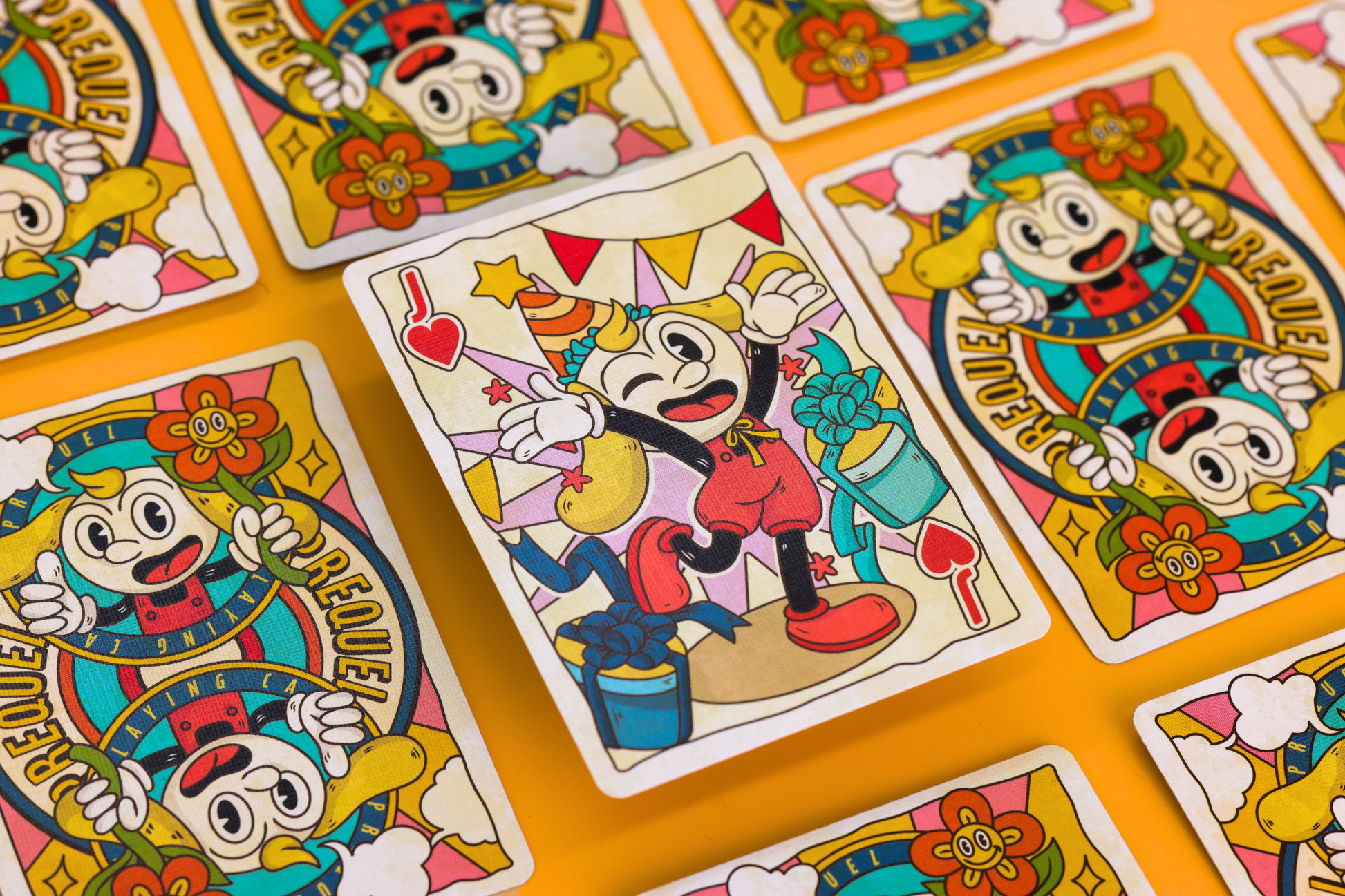 Prequel Edition Jack of Hearts surrounded by Colorful prequel edition card backs with cartoon character design on a yellow background