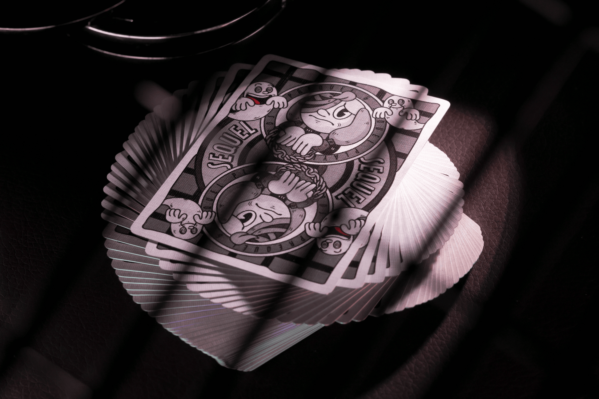 Sequel Playing cards with a unique design on a dark background