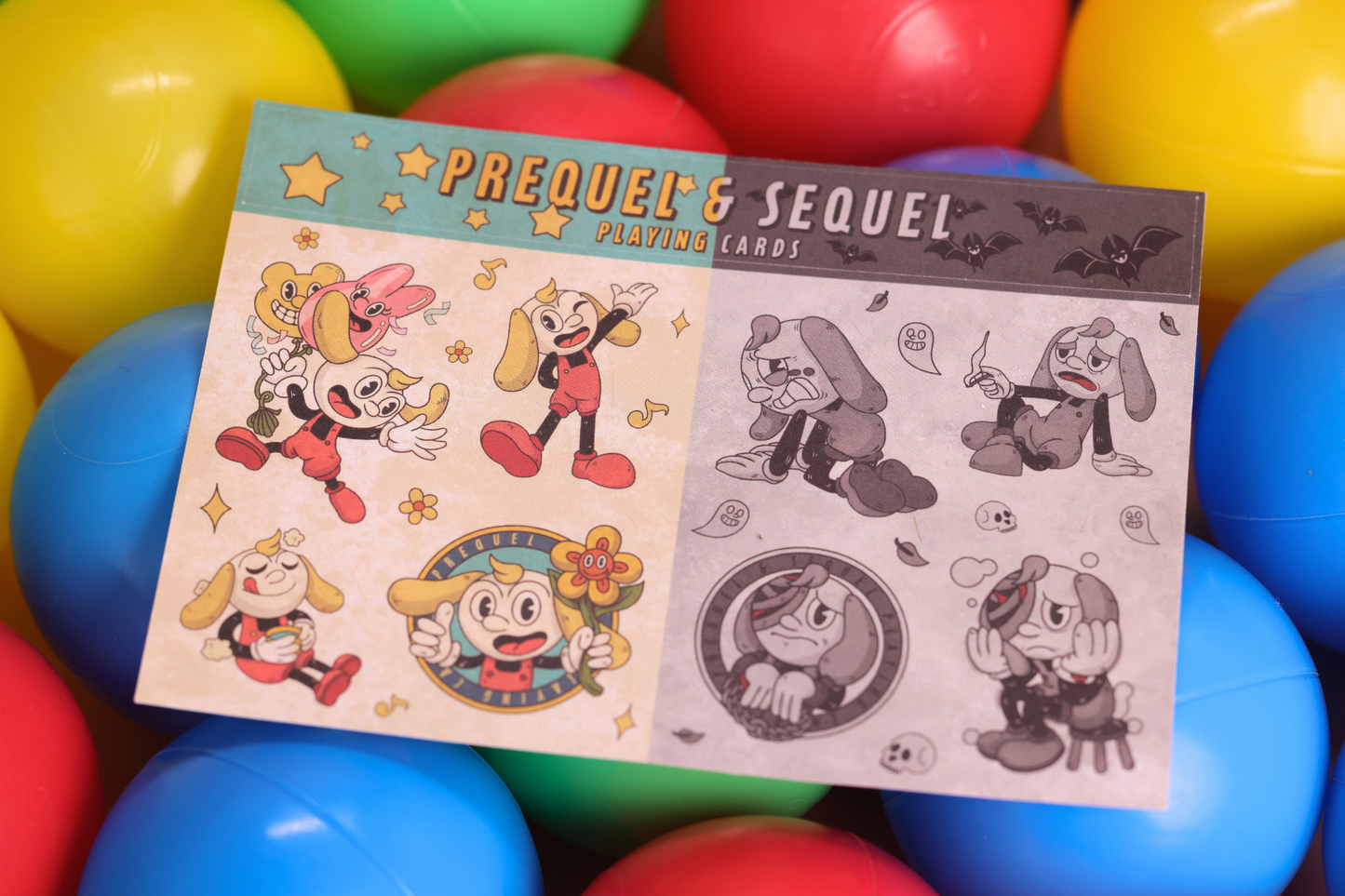 Playing cards titled 'Prequel & Sequel' surrounded by colorful plastic balls