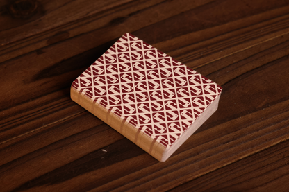 Burgundy Pine on a wooden surface