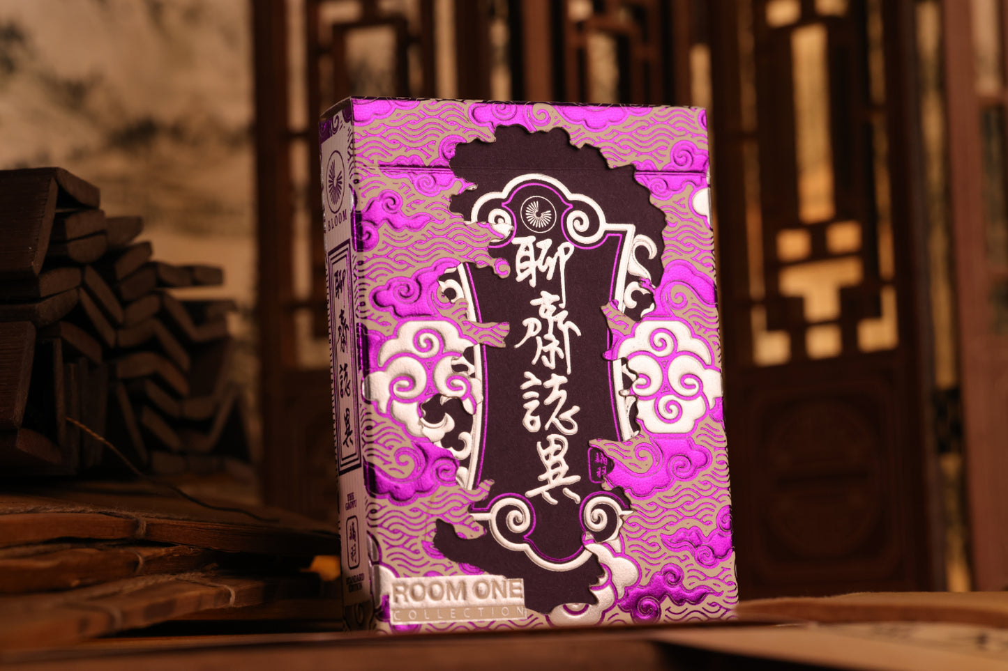 Decorative box with intricate design and text on a wooden surface